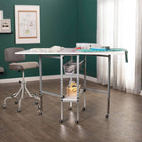 Sew Ready Mobile Folding Cutting Table with Adjustable Height, Quilting Grid, Sewing Board, and Storage, Silver/White